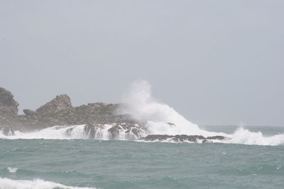 Waves splashing on rocks
