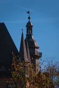 Low angle view of traditional building against clear blue sky