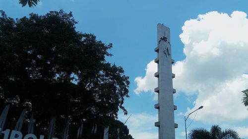 Low angle view of statue against blue sky