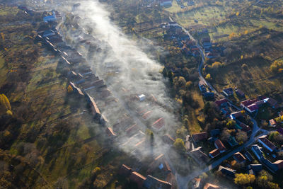 High angle view of a village in transylvania. aerial view of early morning haze, fog