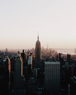 Skyscrapers in city against clear sky