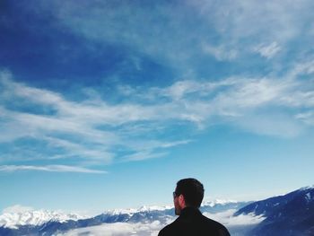 Scenic view of snow covered mountains against sky