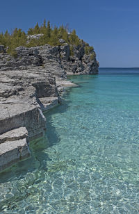 Colorful waters on a sunny day on indian cove inn bruce peninsula national park in ontario