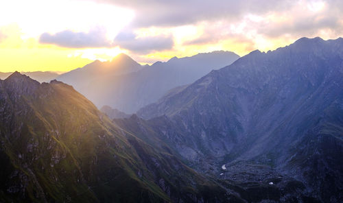 Scenic view of mountains against sky during sunset