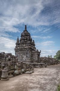 View of old building against cloudy sky