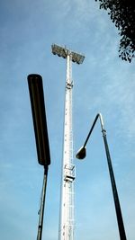 Low angle view of crane against sky