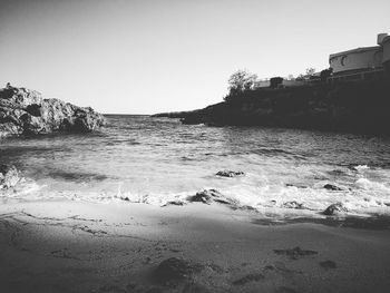 Scenic view of beach against clear sky