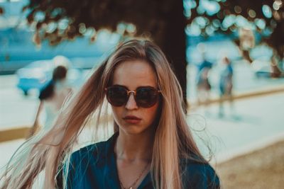 Portrait of young woman wearing sunglasses