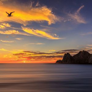 Scenic view of sea at sunset