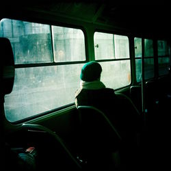 Rear view of man sitting in car