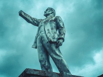 Low angle view of statue against sky