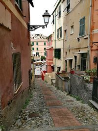 Footpath amidst buildings in town