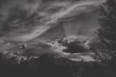 Scenic view of mountains against cloudy sky