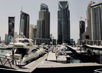 Modern buildings in city against sky