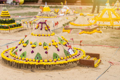 Multi colored umbrellas on table against building