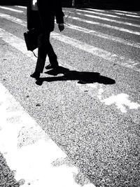 Low section of people walking on road