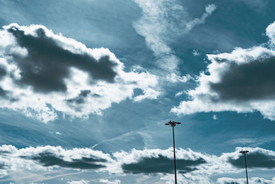 Low angle view of street light against sky