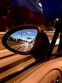 Reflection of car on side-view mirror