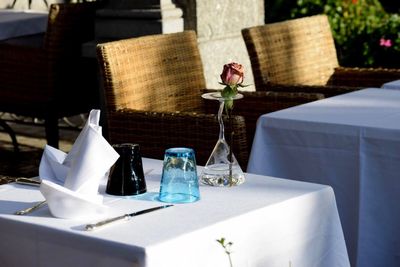 Glass of bottles on table in restaurant