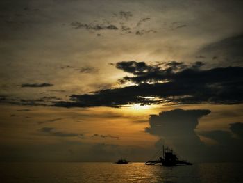 Scenic view of sea against sky at sunset