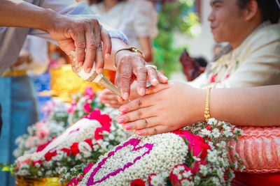 Close-up of couple holding hands