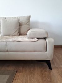 Close-up of sofa against white wall at home