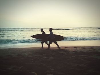 Silhouette of people on beach