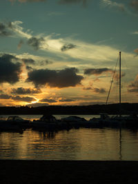 Silhouette of boat at sunset