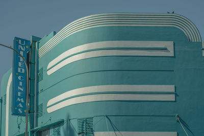 Low angle view of modern building against clear blue sky