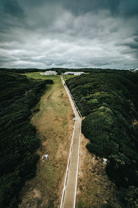 Empty road along countryside landscape