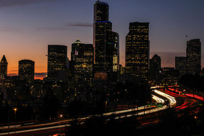 High angle view of illuminated buildings in city at night