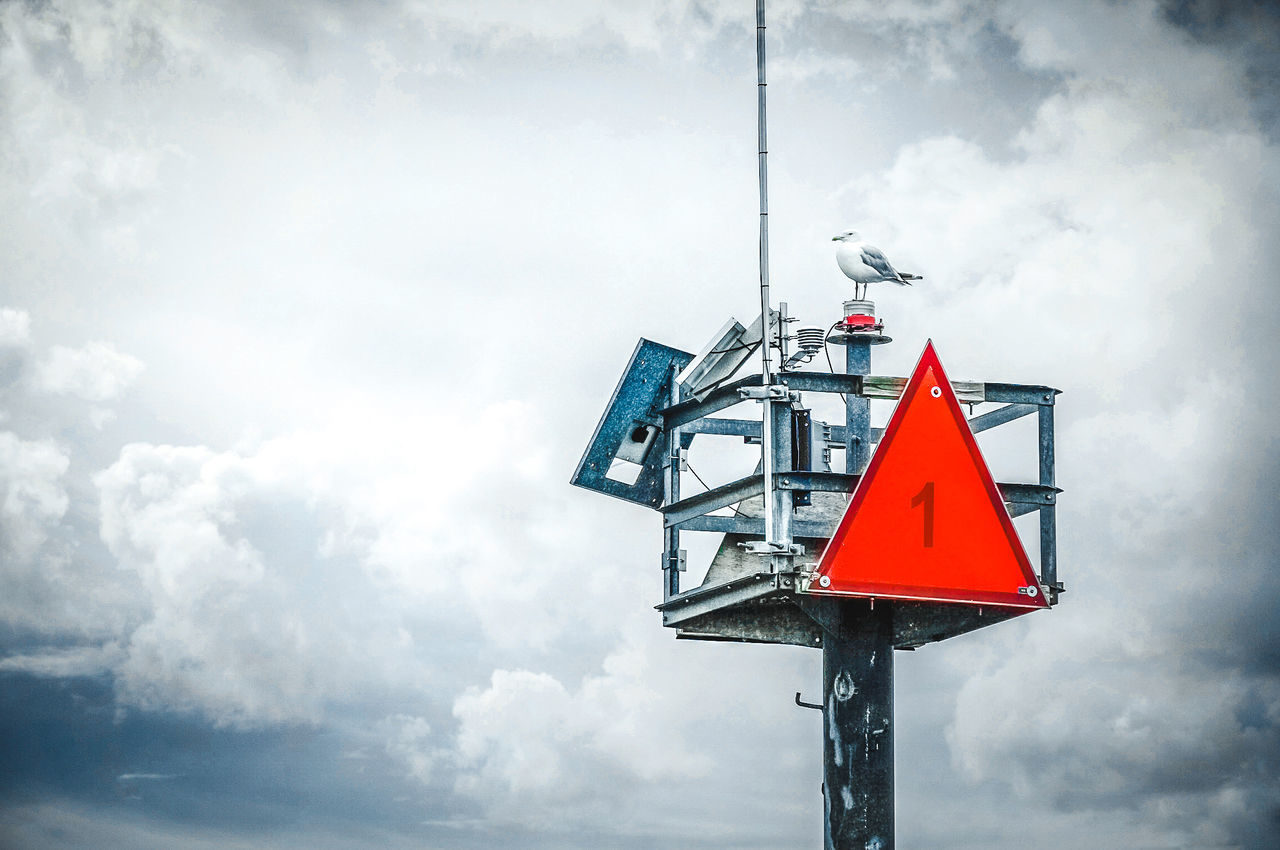 cloud - sky, sky, low angle view, sign, day, communication, nature, no people, outdoors, road sign, red, road, pole, safety, signal, guidance, warning sign, overcast, information, warning symbol