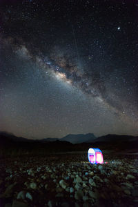 Scenic view of star field against sky at night