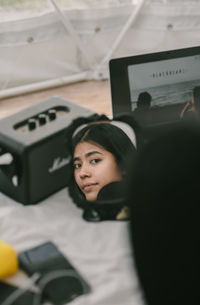 Portrait of young woman using smart phone