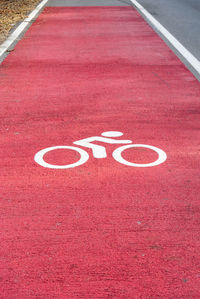 High angle view of bicycle lane sign on road