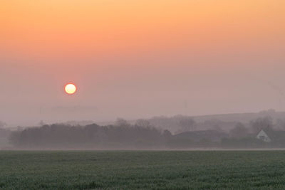 Scenic view of landscape against sky during sunset