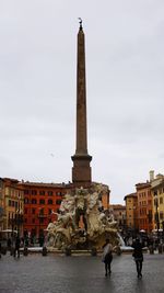 Statue of historic building against sky