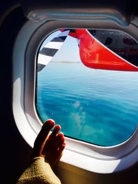 Calm blue sea seen from airplane window