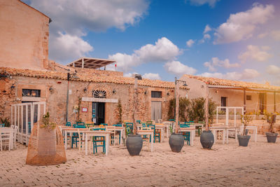 Built structures on beach against sky