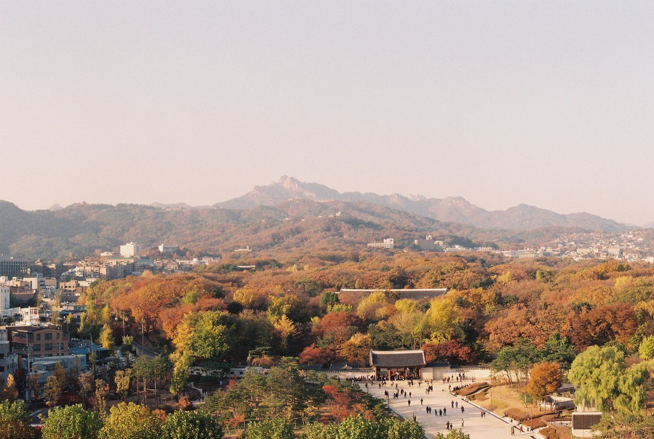 PANORAMIC SHOT OF CITYSCAPE AGAINST CLEAR SKY