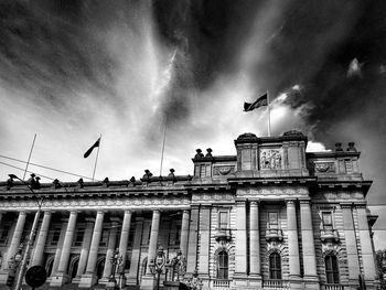 Low angle view of built structure against cloudy sky