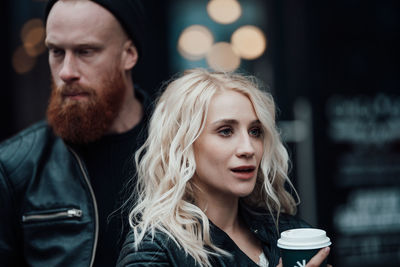 Portrait of young couple looking away