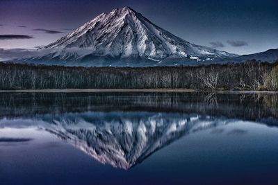 Scenic view of frozen lake against mountain range