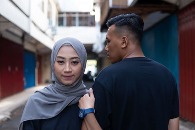 Side view of young woman looking away