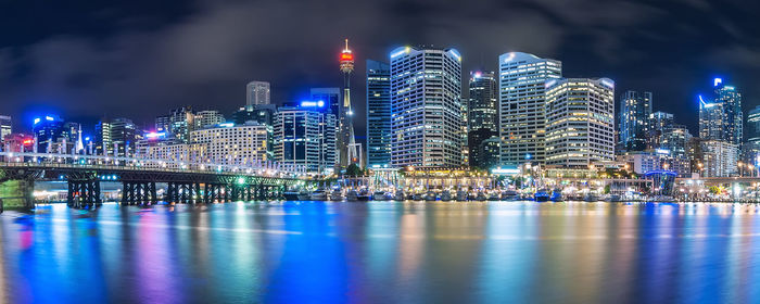 Illuminated city at waterfront