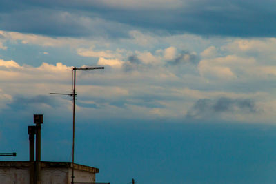 Low angle view of street light against sky