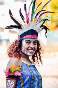 Portrait of smiling young woman in traditional clothing