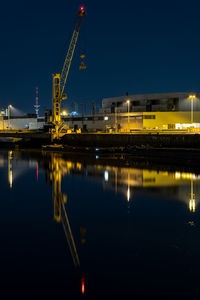 Reflection of illuminated buildings in water at night