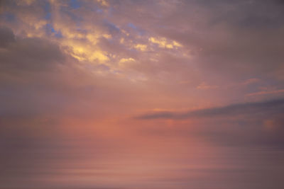 Low angle view of dramatic sky during sunset