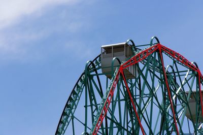 Low angle view of ferris wheel against sky